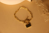 Lock charm clip bracelet