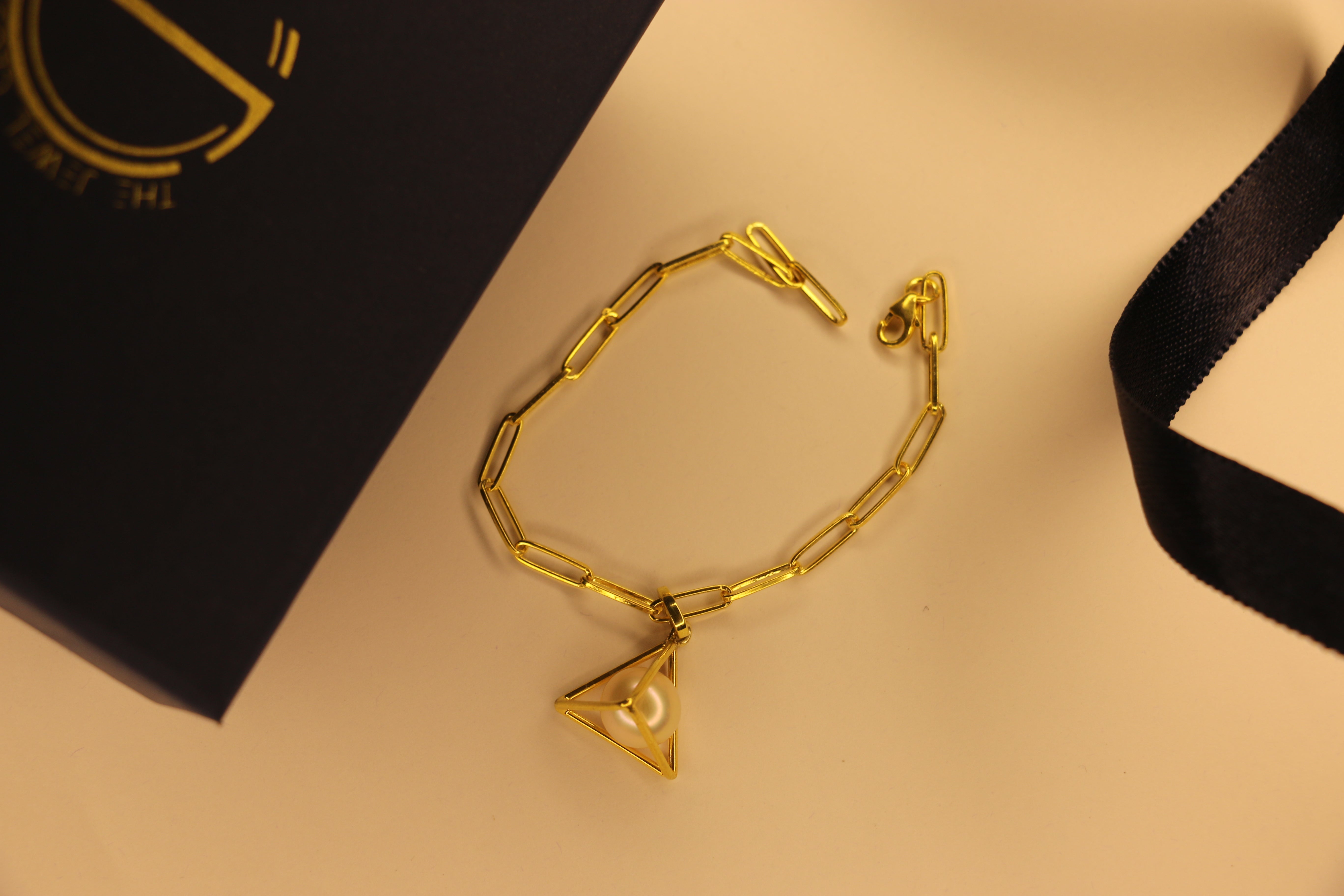 Pearl pyramid charm clip bracelet