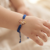Blossoms 92.5 Silver rakhi in blue thread