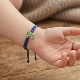 Dinosour 92.5 Silver rakhi in blue thread