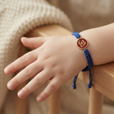 Om Enamel Red 92.5 Silver rakhi in blue thread