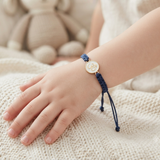Om Enamel White 92.5 Silver rakhi in blue thread