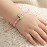 Dinosour 92.5 Silver rakhi in pink thread